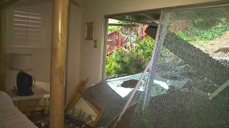 The bedroom of a Baldwin Hills resident is seen after a mudslide crashed through her glass door on Feb. 5, 2024.