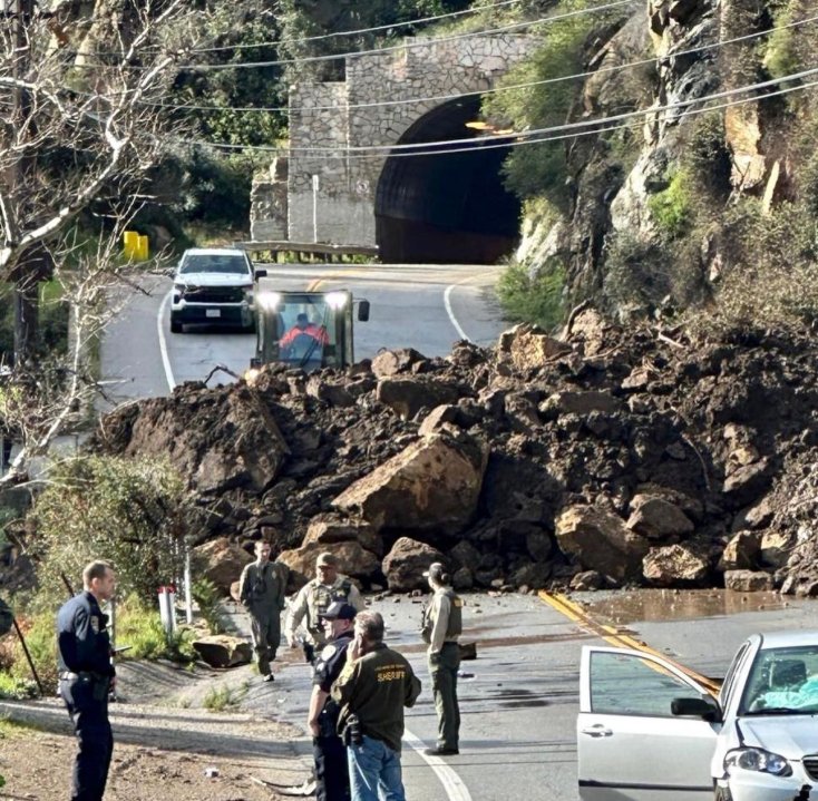 Dirt and boulders covering Malibu Canyon Road are seen in an image posted by the Los Angeles County Fire Department on Feb. 21, 2023.