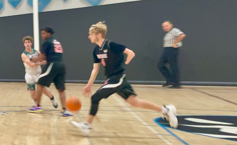 Aidan Goldstein dribbles up the court for WISH Academy High School in this undated photo provided by WISH Charter Schools