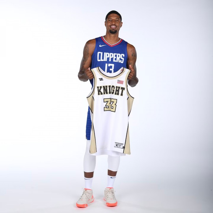 Los Angeles Clippers star Paul George poses with his high school jersey from Knight High School in Palmdale (Los Angeles Clippers)