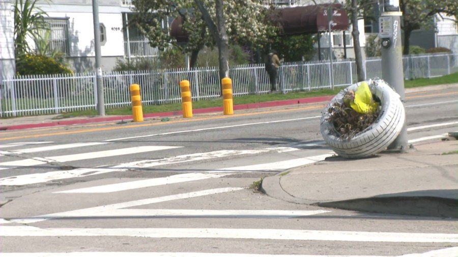 A white tire placed to honor a pedestrian who was killed near a crosswalk in Los Angeles. (KTLA)