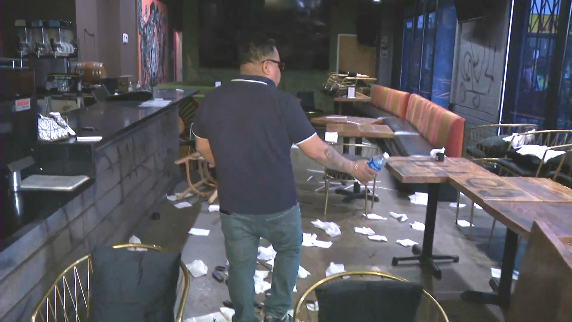 Owner Beto Mendez examining the widespread damage to his restaurant, El Zarape, on Feb. 27, 2024. (KTLA)