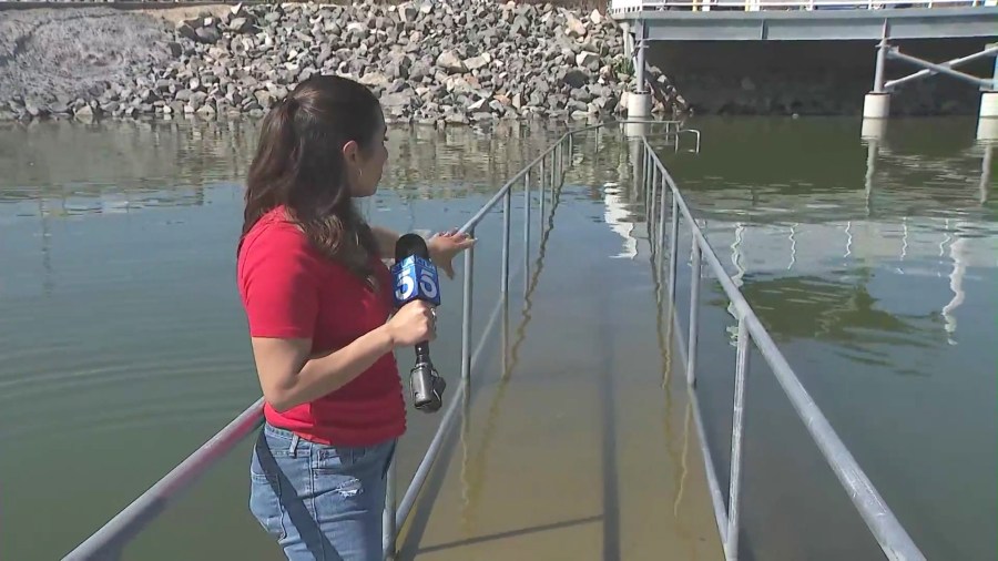 A walkway is fully submerged in Lake Elsinore due to a series of record-breaking rainstorms. (KTLA)