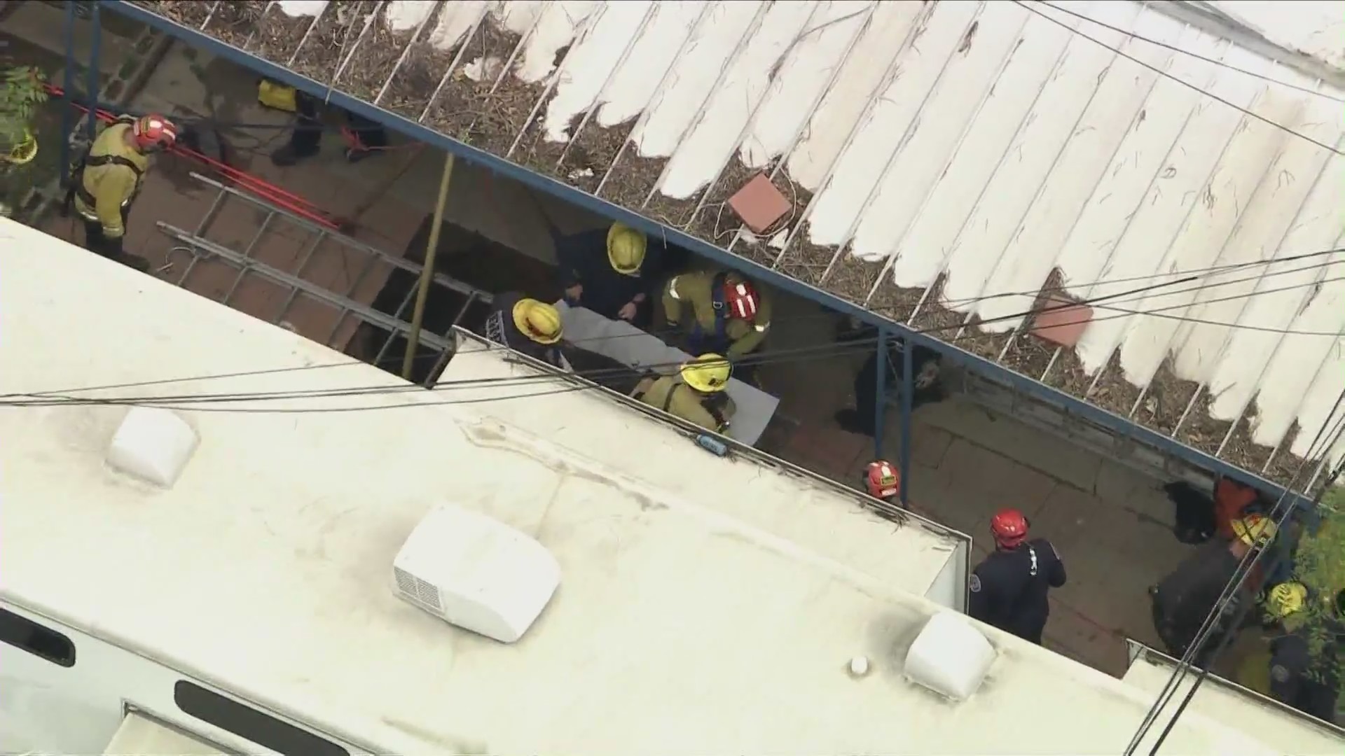 Crews rescue a woman from a sinkhole in Fontana on Feb. 8, 2024.