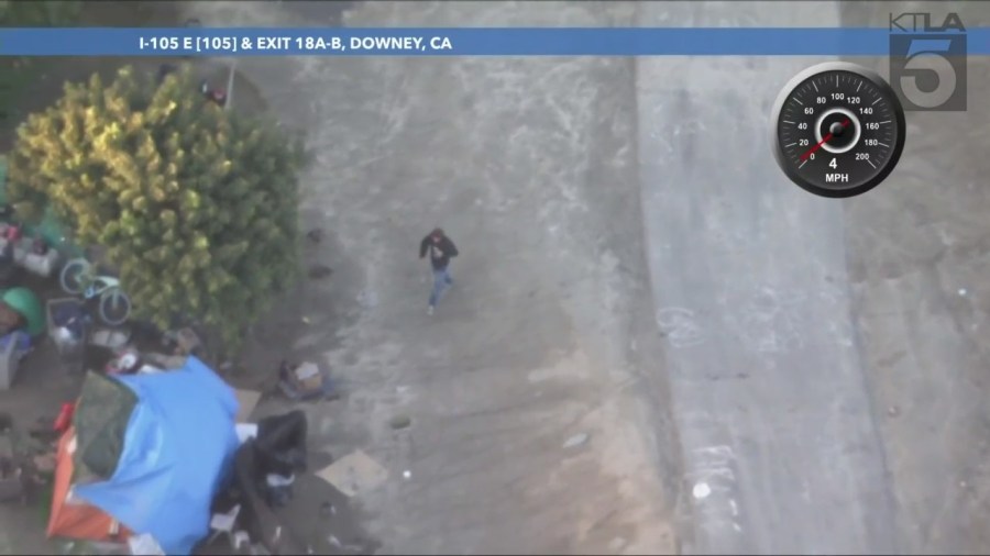 A possible suspect after authorities pursued a stolen pickup truck that crashed into a drainage canal in Los Angeles County on Feb. 2, 2024. (KTLA)