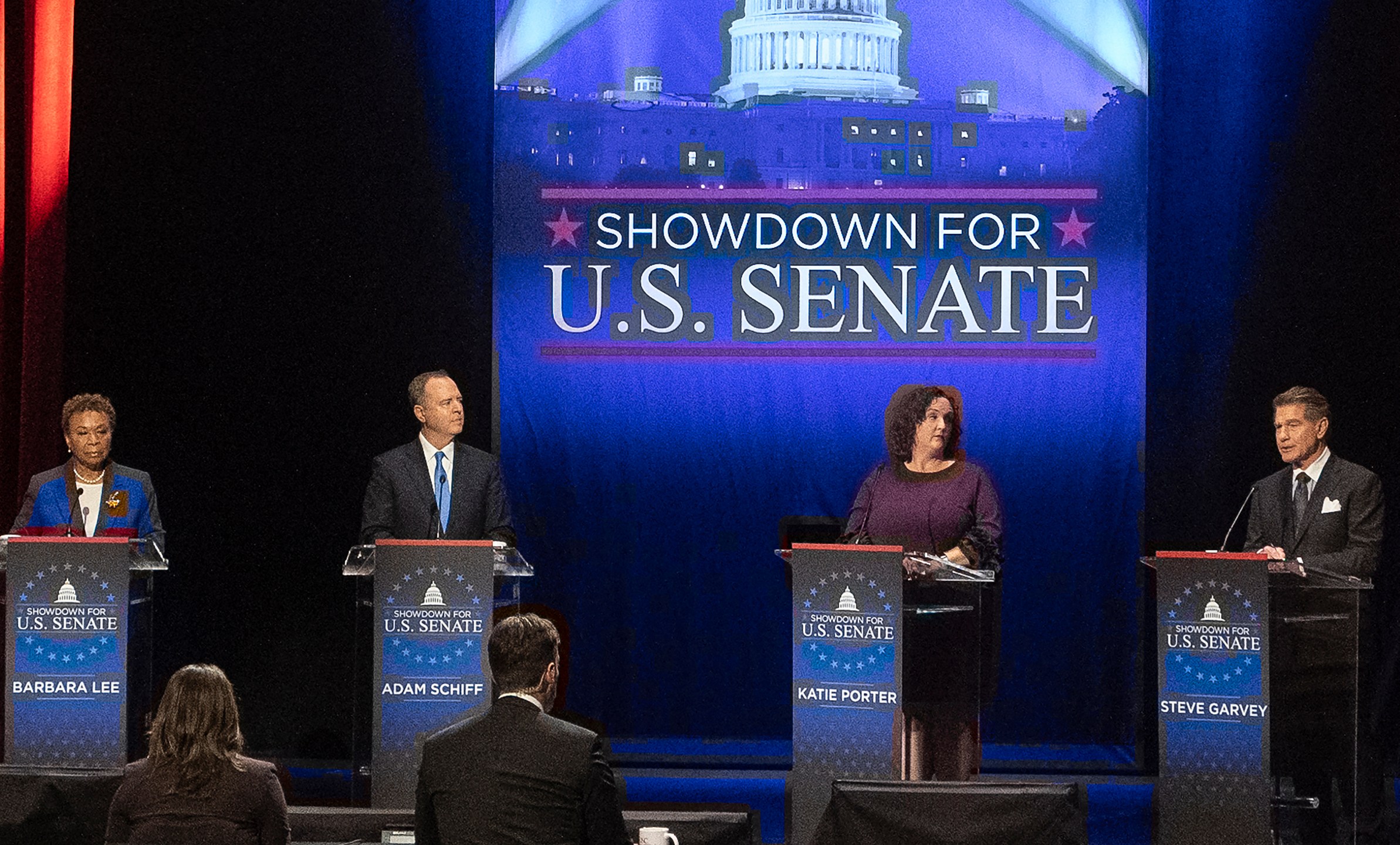 FILE -Candidates, from left, U.S. Rep. Barbara Lee, D-Calif., U.S. Rep. Adam Schiff, D-Calif., U.S. Rep. Katie Porter, D-Calif., and former baseball player Steve Garvey, stand on stage during a televised debate for candidates in the senate race to succeed the late California Sen. Dianne Feinstein, on Monday, Jan. 22, 2024, in Los Angeles. (AP Photo/Damian Dovarganes, File)