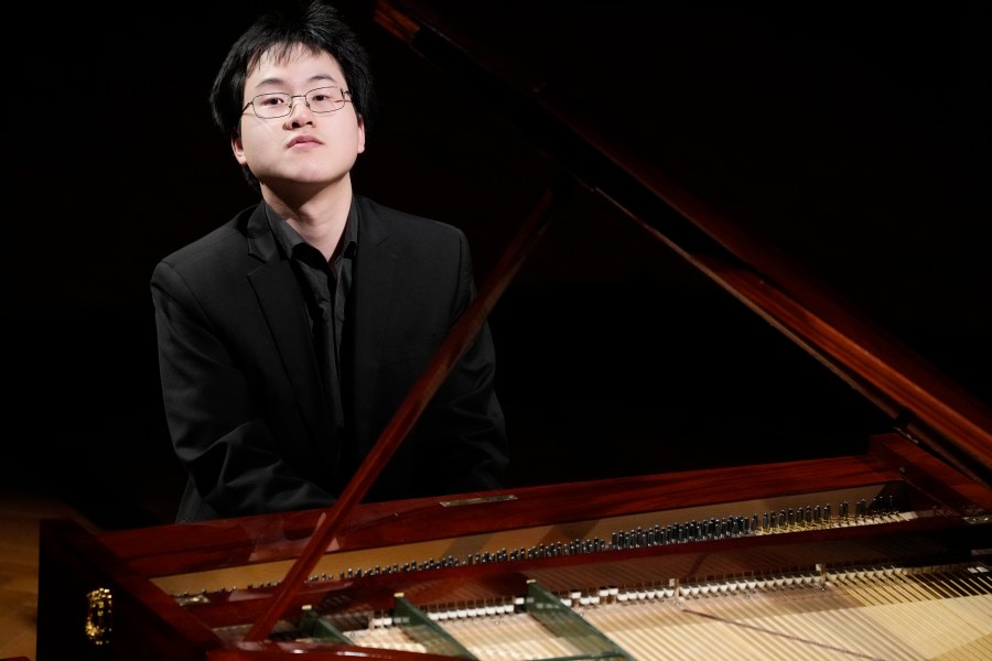 Canadian pianist Eric Guo plays Frederic Chopin's Concerto in F minor on a replica of a 1830 Pleyel piano during a concert marking the 19th century piano virutoso and composer's 214th birthday, in Warsaw, Poland, on Friday, March 1, 2024. Guo won a quintannual competition to play Chopin on period instruments organized by the Fryderyk Chopin Institute. (AP Photo/Czarek Sokolowski)