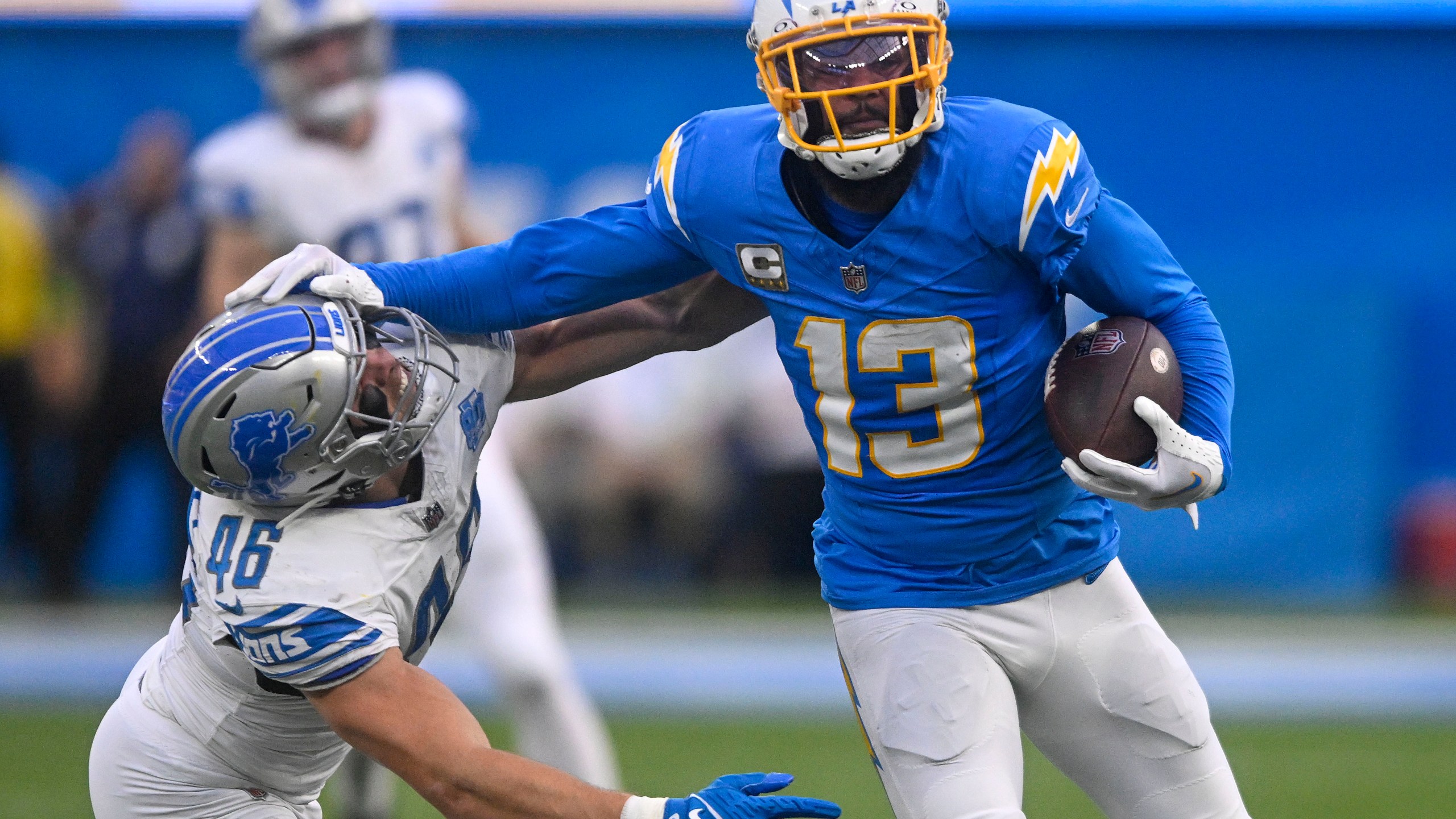 FILE - Los Angeles Chargers wide receiver Keenan Allen (13) rushes past Detroit Lions linebacker Jack Campbell (46) during an NFL football game Sunday, November 12, 2023, in Inglewood, Calif. The Chicago Bears are acquiring wide receiver Keenan Allen from the Los Angeles Chargers for a fourth-round pick, people informed of the decision told The Associated Press on Thursday, March 14, 2024. (AP Photo/Denis Poroy, File)