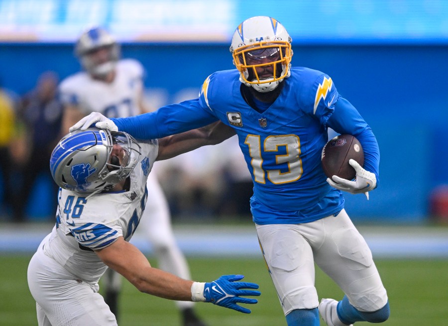 FILE - Los Angeles Chargers wide receiver Keenan Allen (13) rushes past Detroit Lions linebacker Jack Campbell (46) during an NFL football game Sunday, November 12, 2023, in Inglewood, Calif. The Chicago Bears are acquiring wide receiver Keenan Allen from the Los Angeles Chargers for a fourth-round pick, people informed of the decision told The Associated Press on Thursday, March 14, 2024. (AP Photo/Denis Poroy, File)