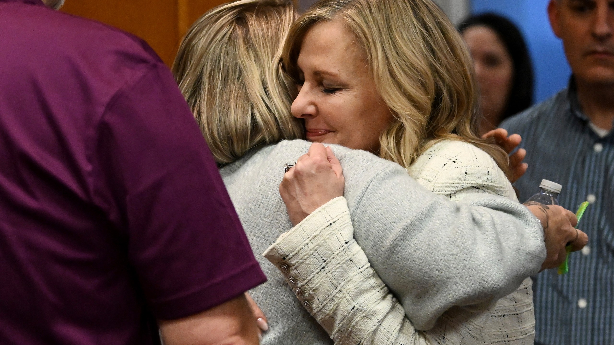 Oakland County prosecutor Karen McDonald, right, hugs Nicole Beausoleil, mother of Madisyn Baldwin, after the guilty verdict of James Crumbley, in Oakland County Court in Pontiac, Mich., Thursday, March 14, 2024. Crumbley, the father of Michigan school shooter Ethan Crumbley, was found guilty of involuntary manslaughter, a second conviction against the teen’s parents who were accused of failing to secure a gun at home and doing nothing to address acute signs of his mental turmoil. (Robin Buckson/Detroit News via AP, Pool)