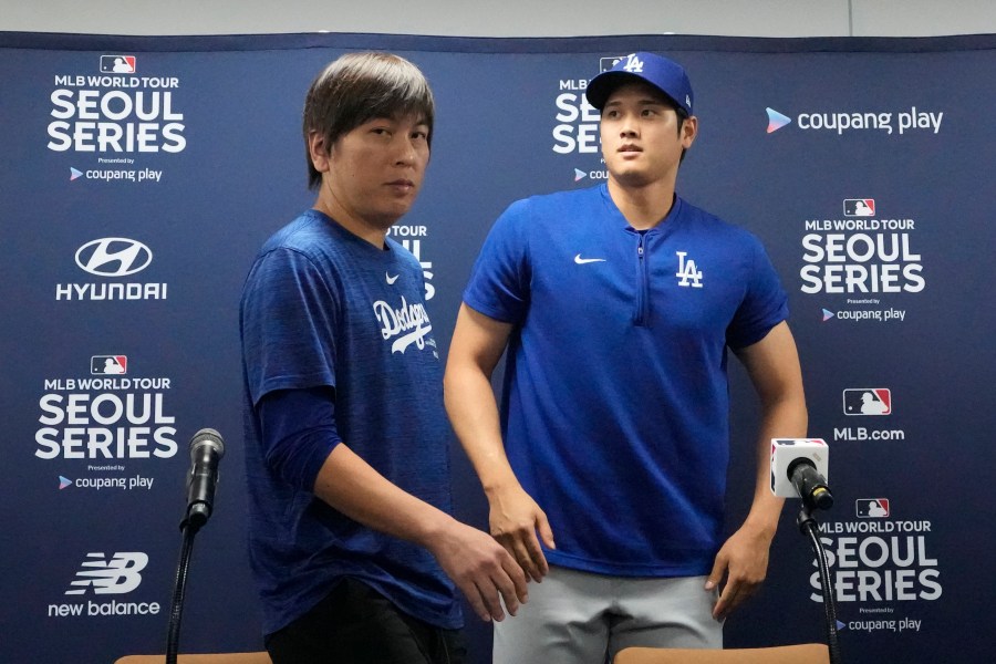 Los Angeles Dodgers' Shohei Ohtani, right, and his interpreter, Ippei Mizuhara, leave after at a news conference ahead of a baseball workout at Gocheok Sky Dome in Seoul, South Korea, Saturday, March 16, 2024. Ohtani’s interpreter and close friend has been fired by the Dodgers following allegations of illegal gambling and theft from the Japanese baseball star. (AP Photo/Lee Jin-man)