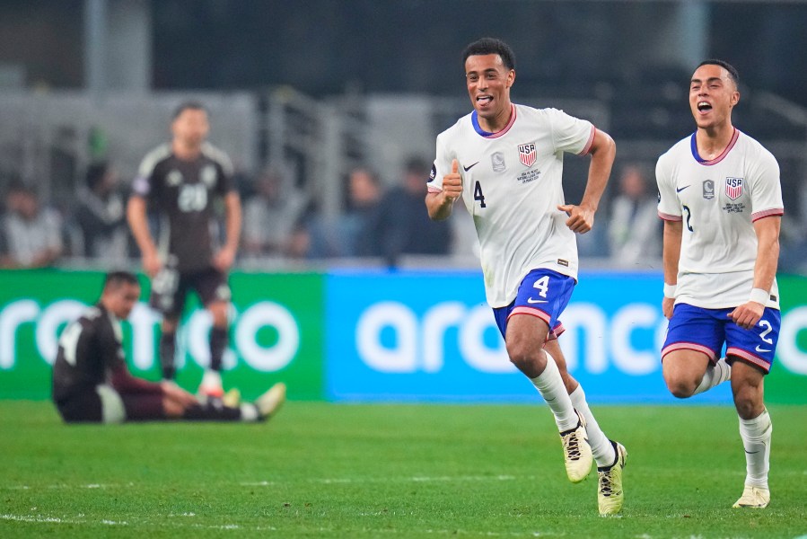 United States midfielder Tyler Adams (4) celebrates his goal with defender Sergino Dest during the first half of a CONCACAF Nations League final soccer match against Mexico, Sunday, March 24, 2024, in Arlington, Texas. (AP Photo/Julio Cortez)