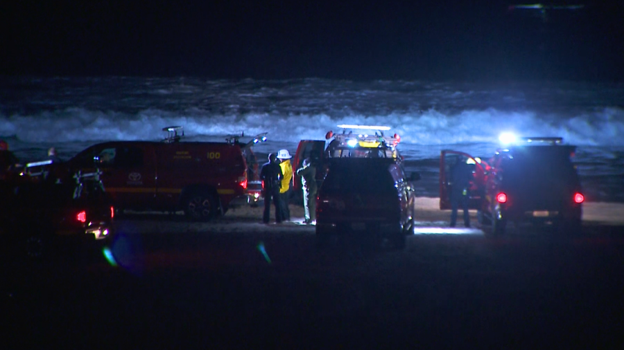 Life guards search for a missing swimmer off Dockweiler State Beach on March 20, 2024.