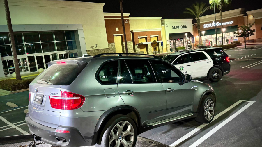 An SUV is towed following a burglary attempt in Upland on March 19, 2024.