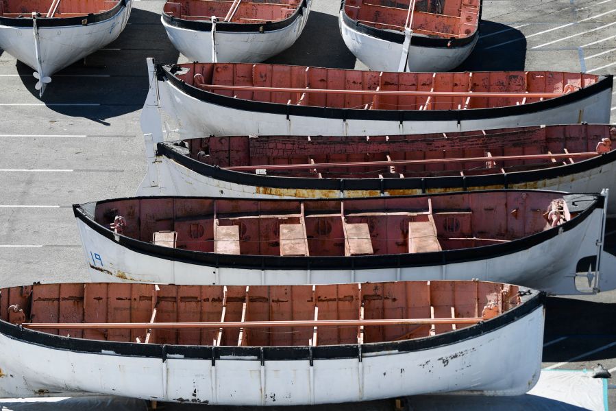 Lifeboats removed from the Queen Mary historic ocean liner sit in a parking lot during major repairs and renovations in Long Beach, California, on February 18, 2022. (Getty Images)