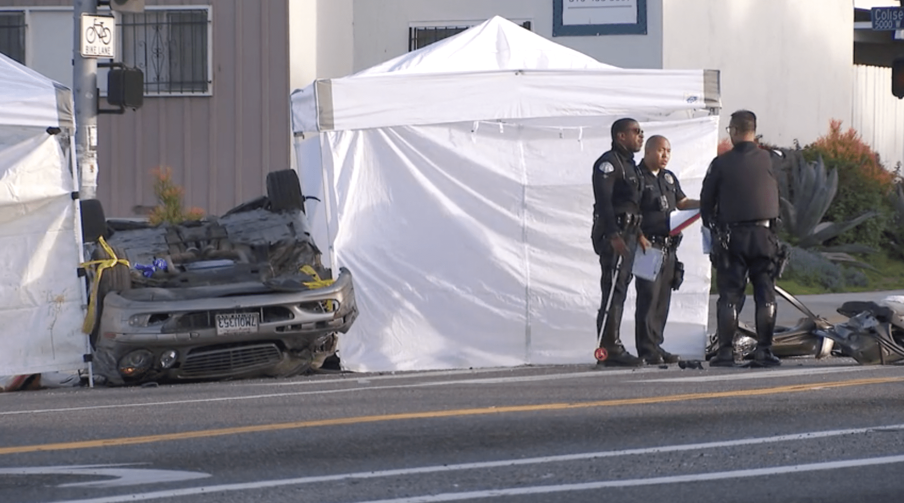 LAPD officers investigate after two people were killed following a multi-vehicle crash in Baldwin Hills on March 9, 2024. (KTLA)