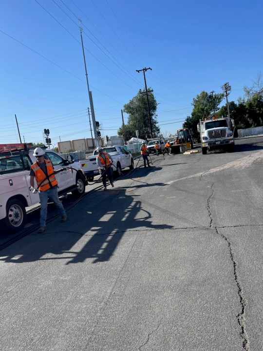 Crews work to replace stolen copper along the Metrolink right-of-way in this undated photo provided by Metrolink.