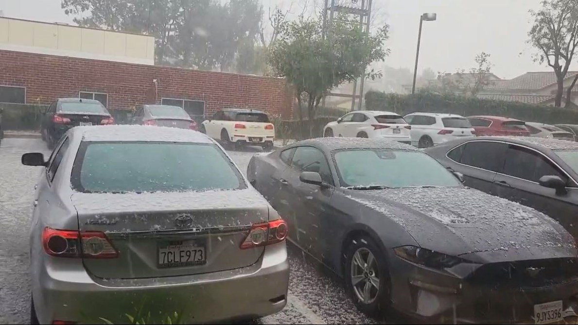 Large pieces of hail rained down on parked vehicles in Porter Ranch during a thunderstorm on March 7, 2024. (@shayera)