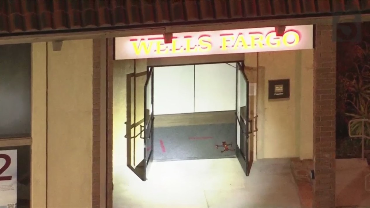 Remote-controlled robots and drones carefully enter and inspect a Wells Fargo bank after a bomb threat on March 26, 2024. (KTLA)