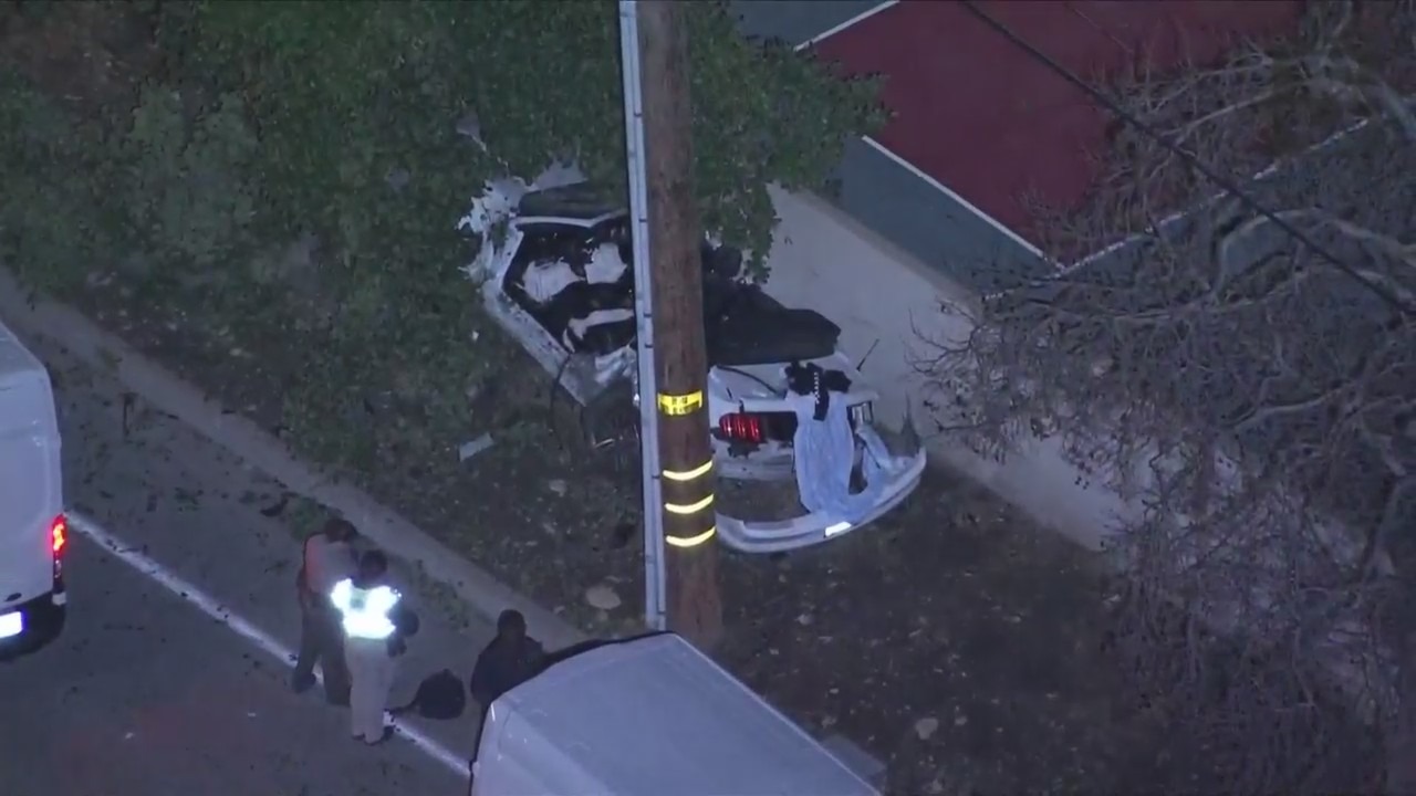 Investigators at the scene of a fatal single-vehicle accident in Rancho Cucamonga that left two teens dead on March 8, 2024. (KTLA)