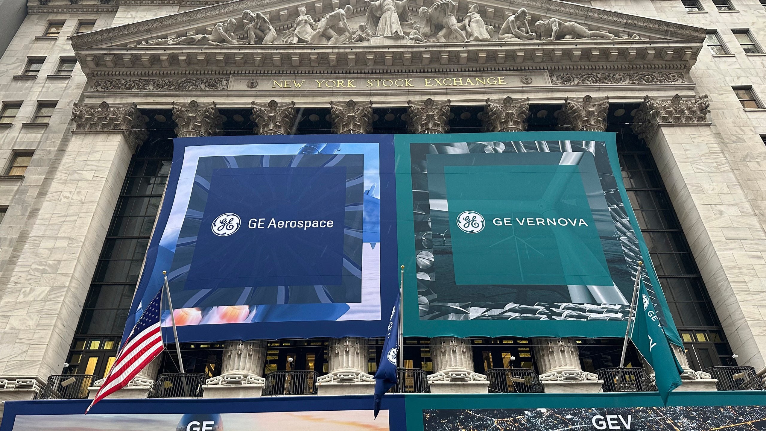 General Electric banners hangs on the facade of New York Stock Exchange Tuesday, April 2, 2024 in New York. General Electric has completed its split of the one-time conglomerate into three separate companies, as its aerospace and energy businesses prepare to start trading on the New York Stock Exchange as separate entities. (AP Photo/Peter Morgan)