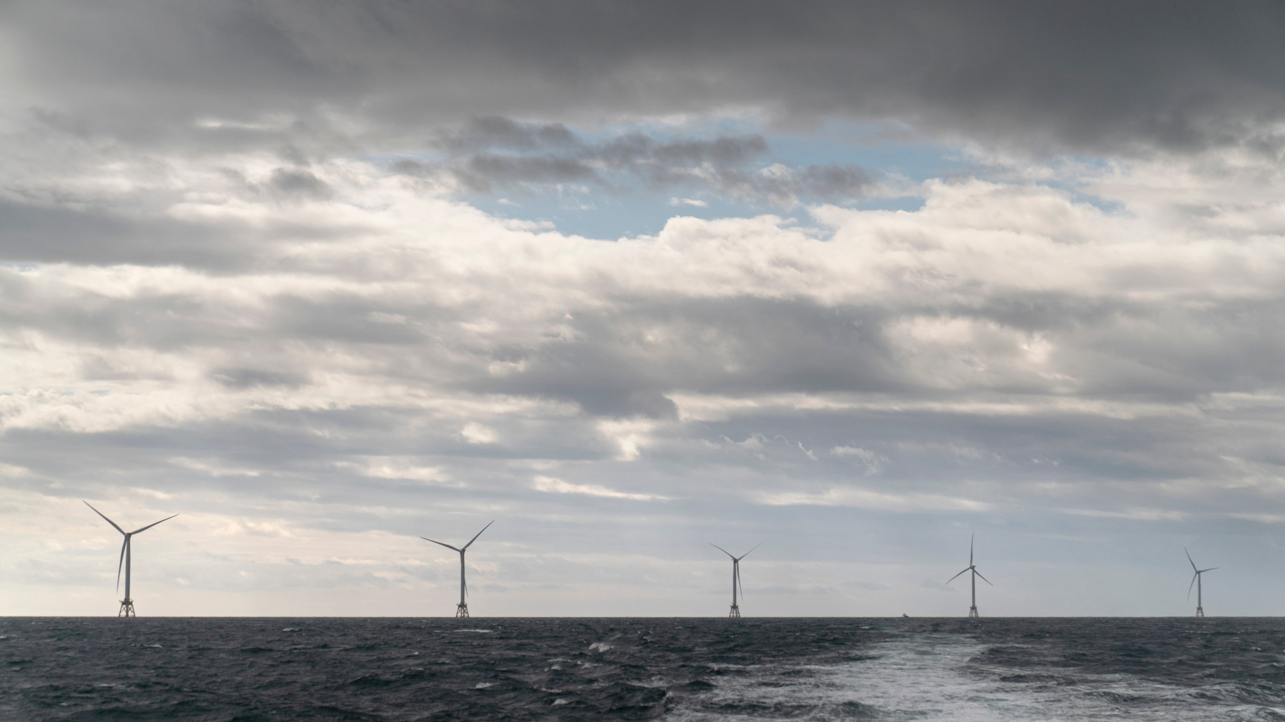 FILE - The turbines of America's first offshore wind farm are seen from a tour boat off the coast of Block Island, R.I., Oct. 17, 2022. The Biden administration approved a new offshore wind project off the Massachusetts coast Tuesday, April 2, 2024. (AP Photo/David Goldman, File)