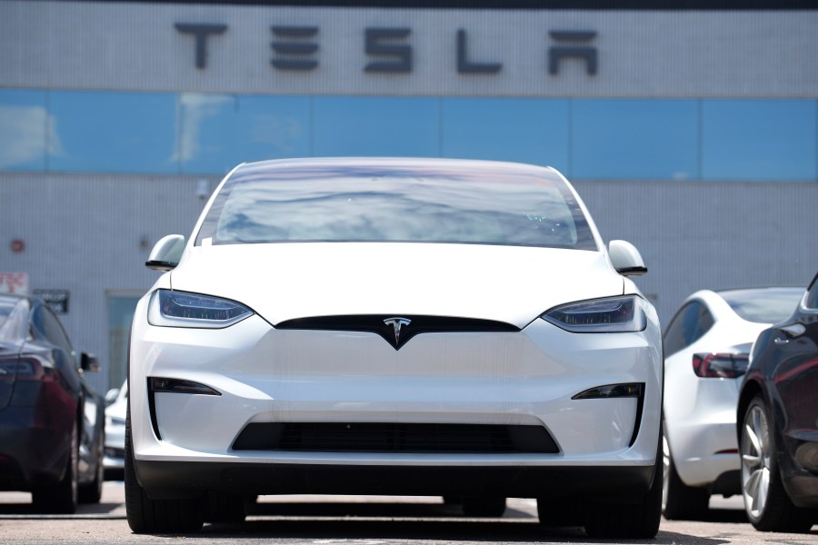 FILE - An Unsold 2023 Model X sports-utility vehicle sits outside a Tesla dealership Sunday, June 18, 2023, in Englewood, Colo. Tesla sales are expected to fall in the first quarter as demand for electric vehicles continues to slow. (AP Photo/David Zalubowski, File)