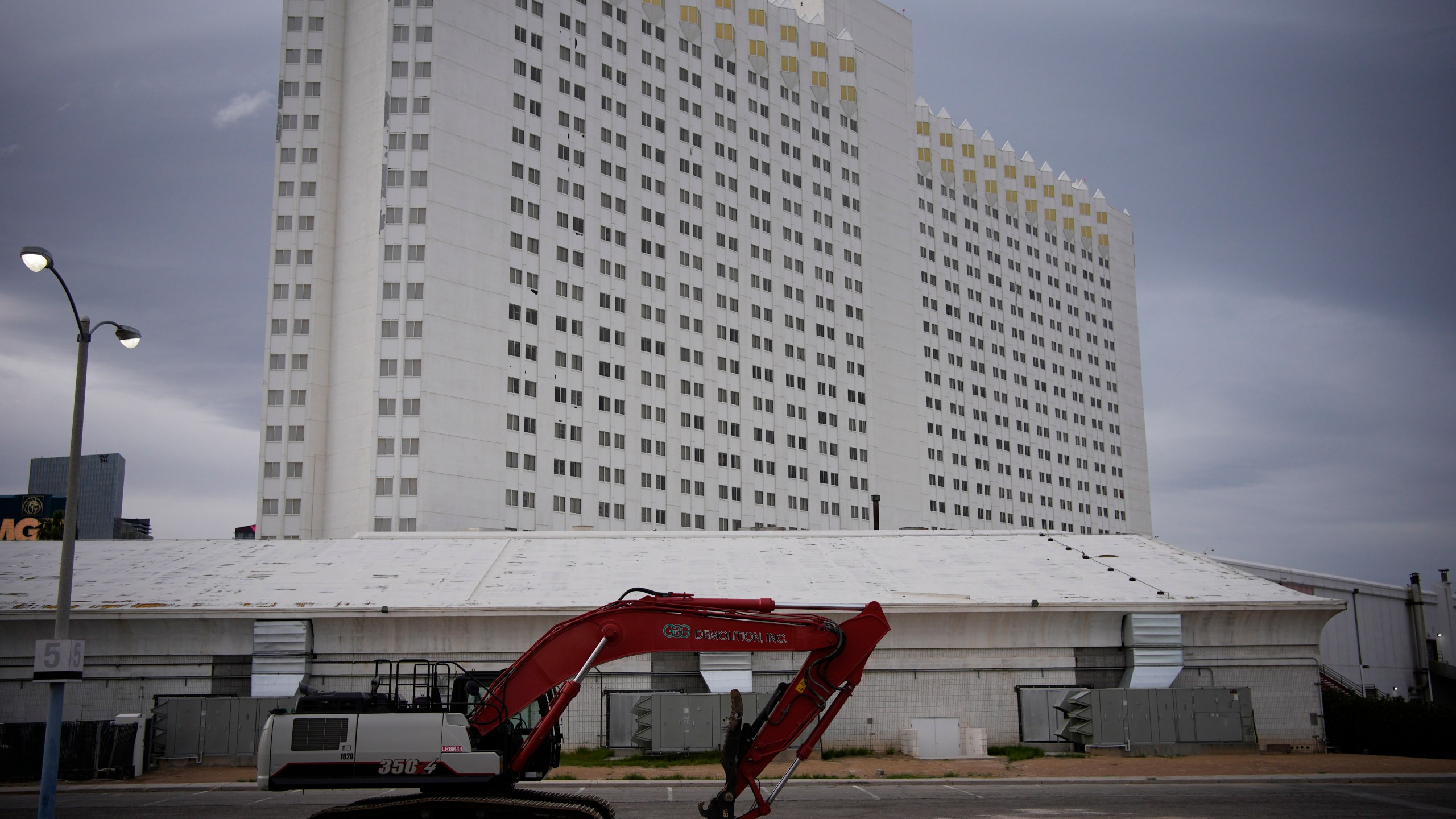 Construction equipment is parked in back of the Tropicana hotel-casino Thursday, March 28, 2024, in Las Vegas. The casino, which is closing April 2, will be demolished to make room for a proposed baseball stadium. (AP Photo/John Locher)