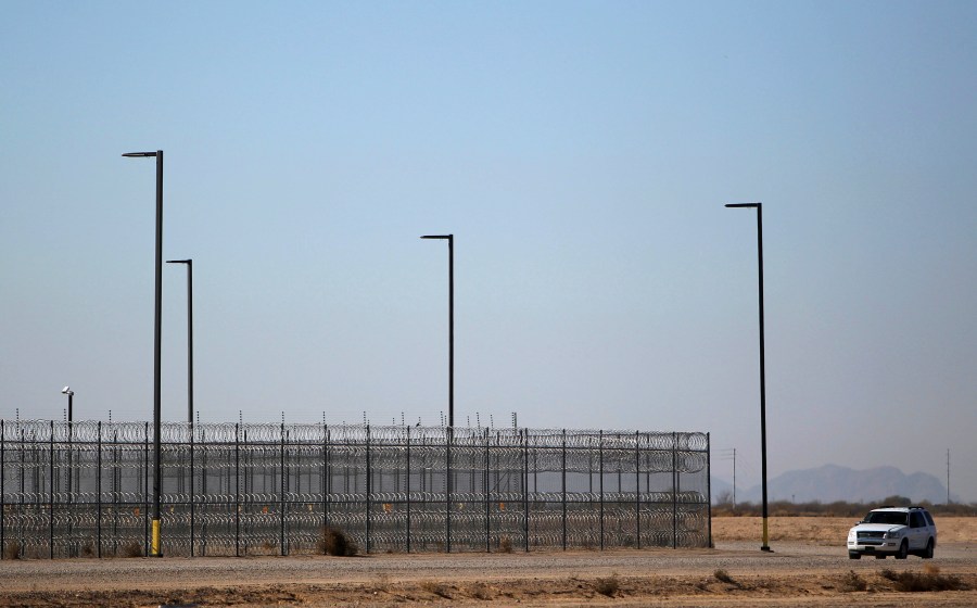 FILE - An unmarked police truck outside of a detention center in Eloy, Ariz. on Jan. 20, 2016. A company that provides services for immigrants in federal detention was ordered Tuesday, April 2, 2024, to pay more than $811 million in restitution and penalties in a lawsuit alleging it used deceptive and abusive tactics. (AP Photo/Ricardo Arduengo, File)