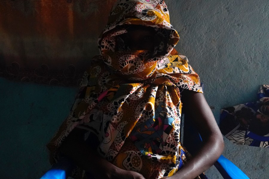 Carole, a 32-year-old former combatant, sits in her home in Bouar, Central African Republic, Thursday, March 7, 2024. Nearly 5,000 fighters have put down their arms in Central African Republic since a disarmament program launched nearly a decade ago. Yet former rebels, communities and conflict experts say it's hard to halt fighting in a country still in conflict and where little other paid work exists. (AP Photo/Sam Mednick)