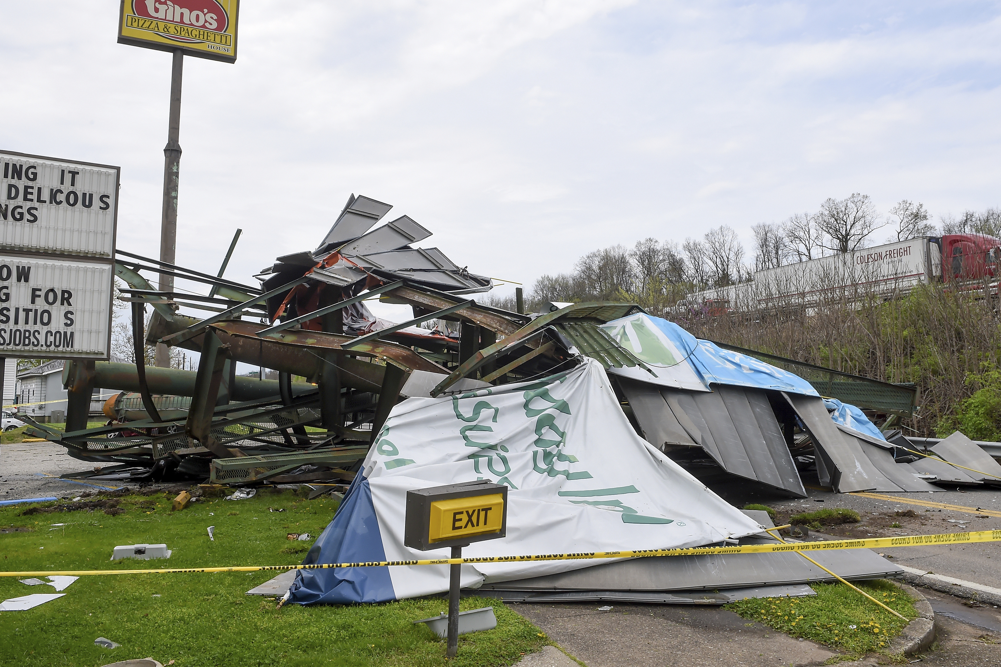A steel billboard and its support were blown over in Dunbar, W.Va., Tuesday, April 2, 2024, after severe storms blew through the area. (Chris Dorst/Charleston Gazette-Mail via AP)