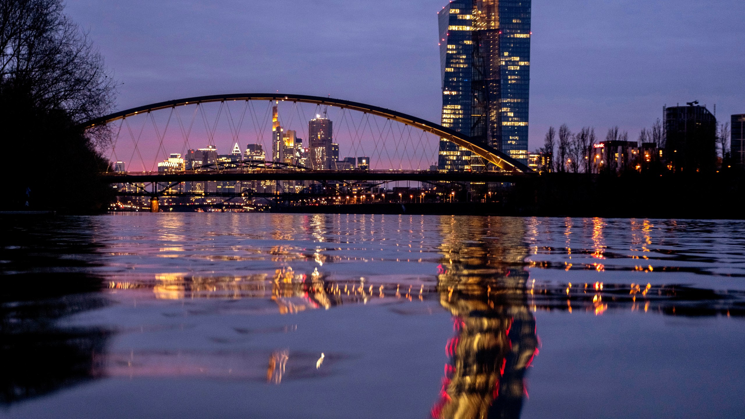 FILE - The European Central Bank is reflected in the river Main in Frankfurt, Germany, Thursday, March 21, 2024. The inflation that has squeezed European shoppers fell more than expected in March to 2.4%, as cost spikes in the grocery aisle eased and overall price rises headed down in the two biggest economies, Germany and France. (AP Photo/Michael Probst, File)