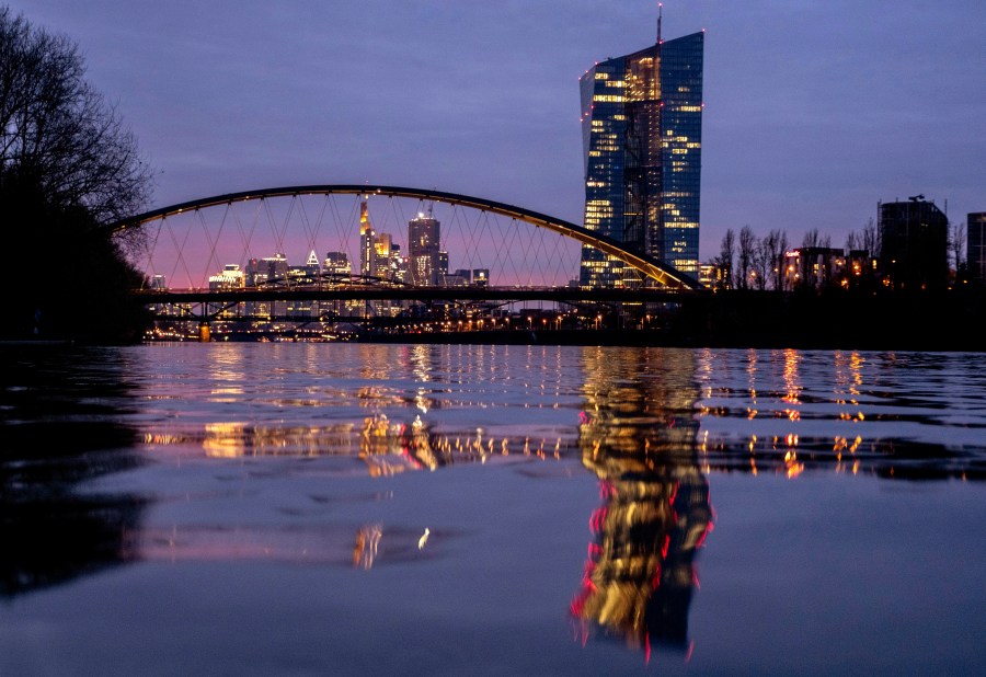 FILE - The European Central Bank is reflected in the river Main in Frankfurt, Germany, Thursday, March 21, 2024. The inflation that has squeezed European shoppers fell more than expected in March to 2.4%, as cost spikes in the grocery aisle eased and overall price rises headed down in the two biggest economies, Germany and France. (AP Photo/Michael Probst, File)