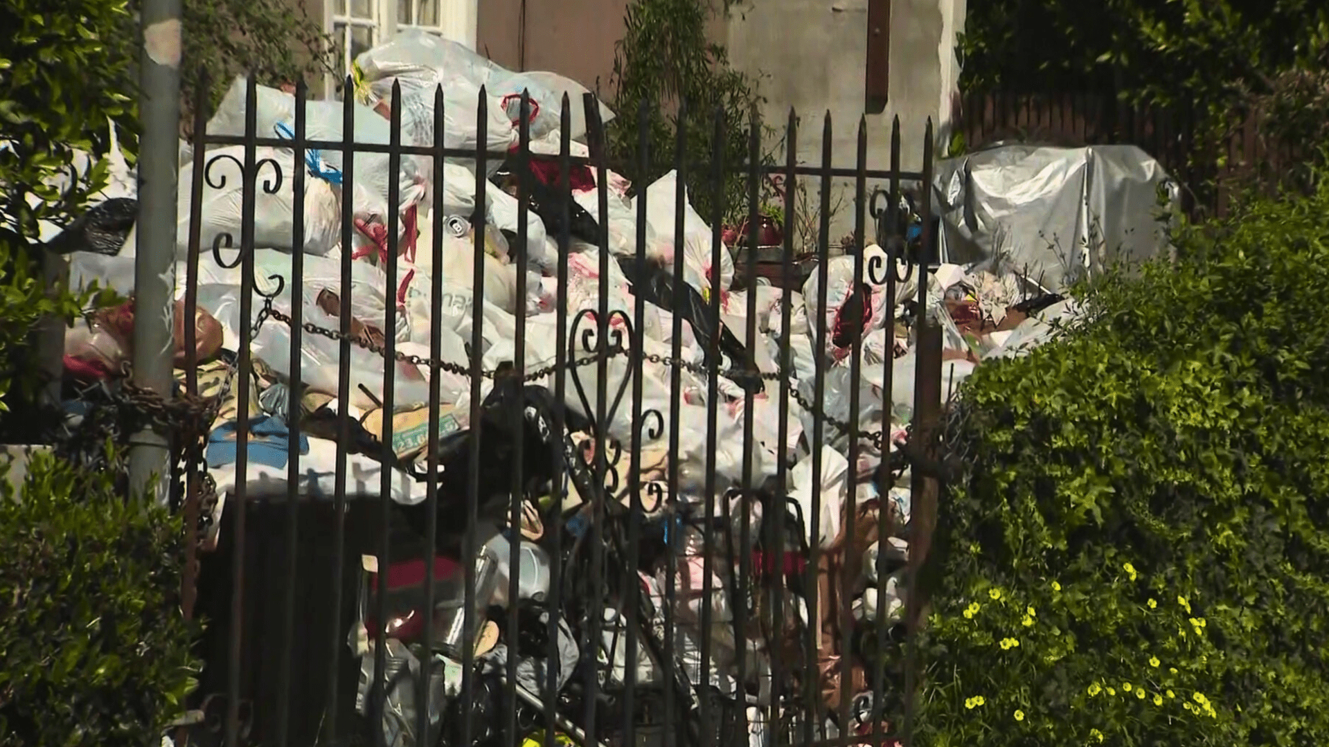 Trash is seen in the front yard of a Fairfax home on April 2, 2024.