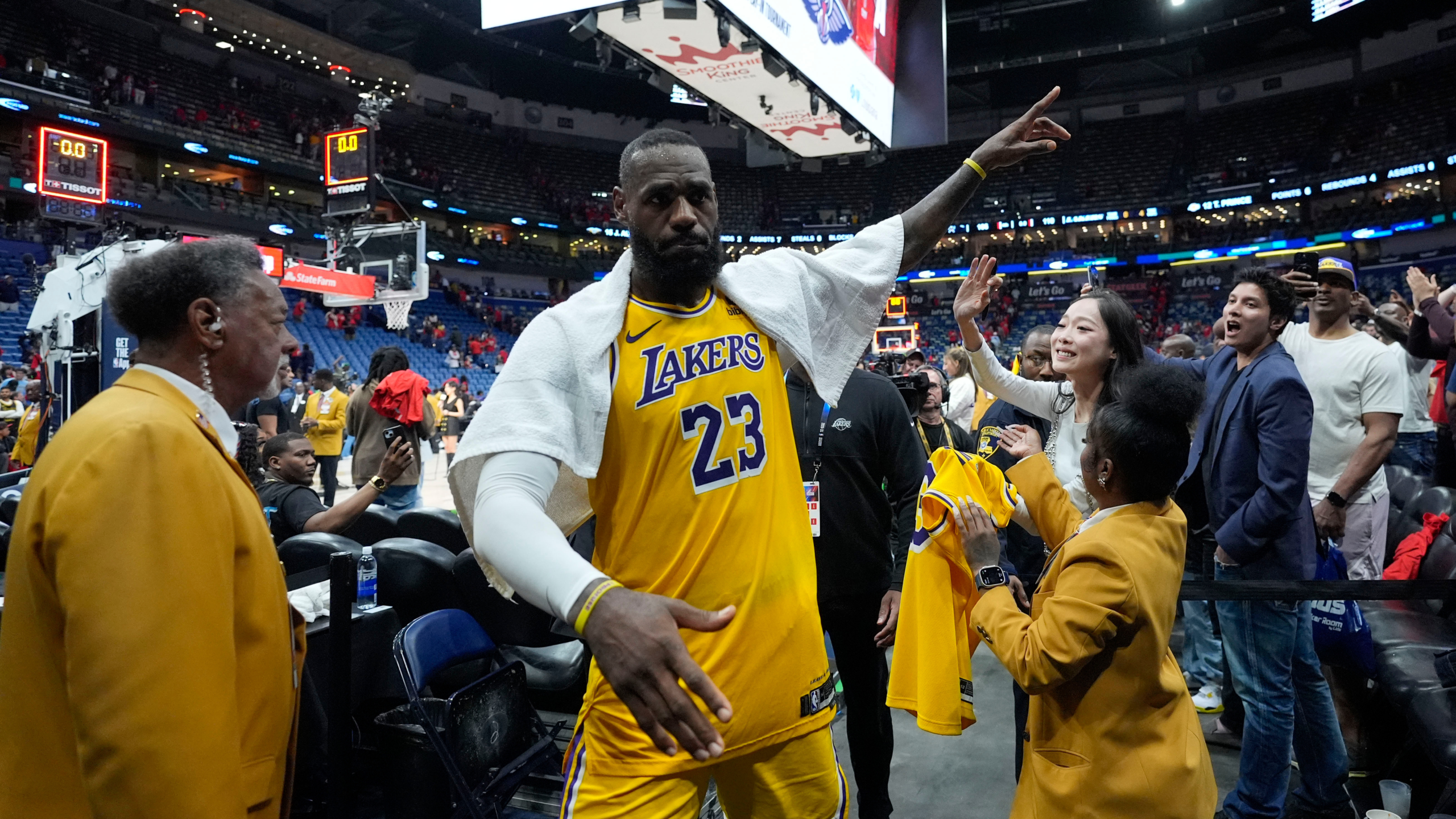 Los Angeles Lakers forward LeBron James acknowledges fans as he leaves the court after an NBA basketball play-in tournament game against the New Orleans Pelicans, Tuesday, April 16, 2024, in New Orleans.