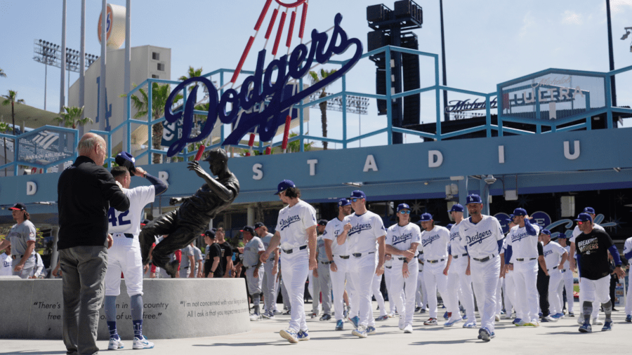 Los Angeles Dodgers and Washington Nationals team members arrive to celebrate Jackie Robinson Tribute Day before a baseball game at Dodgers Stadium in Los Angeles on Monday, April 15, 2024.