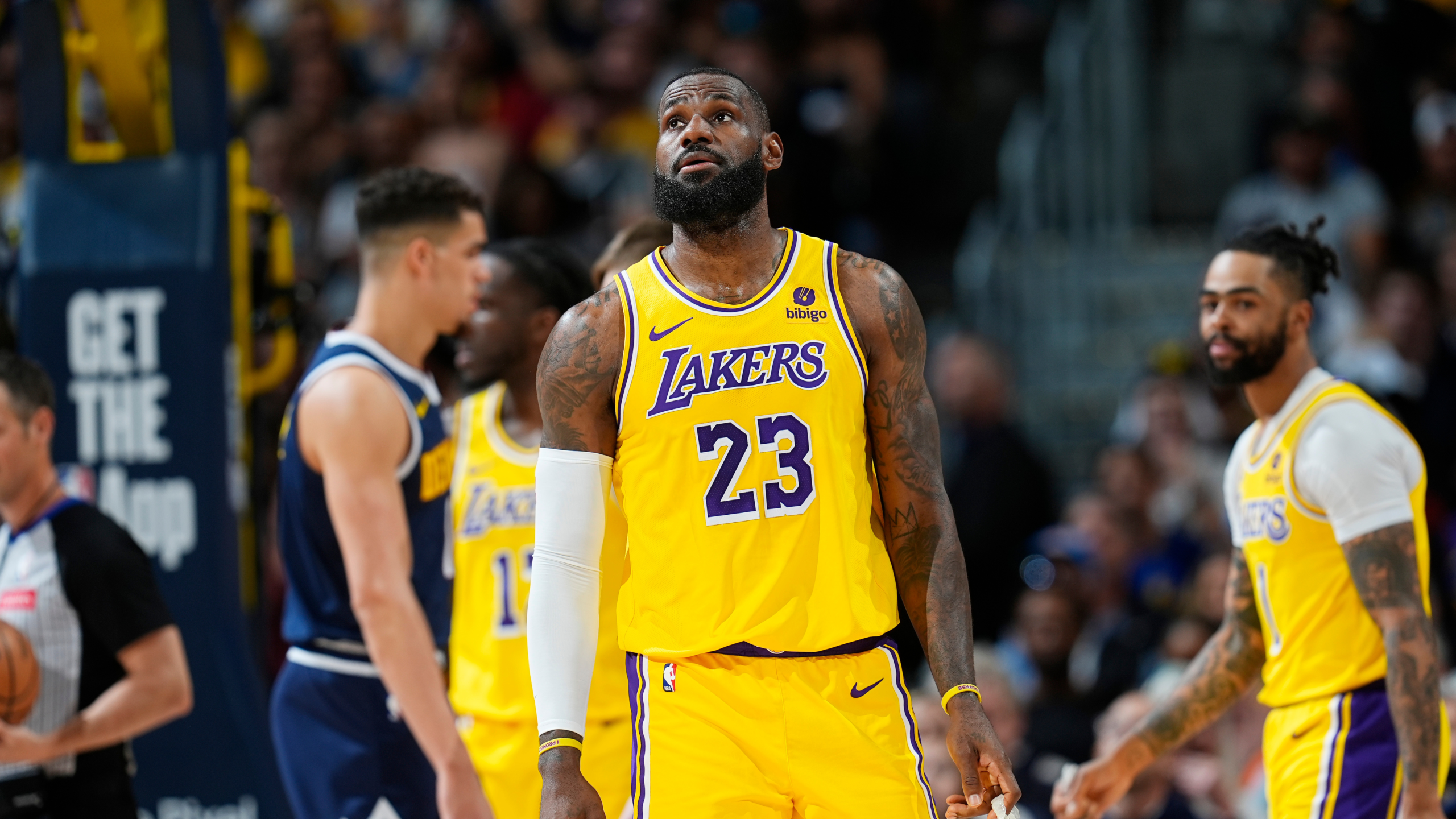 Los Angeles Lakers forward LeBron James checks the scoreboard in Game 5 of an NBA basketball playoff series against the Denver Nuggets, Monday, April 29, 2024, in Denver.