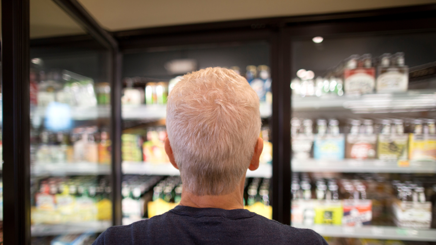 A man selects beer from a cooler in this file image.