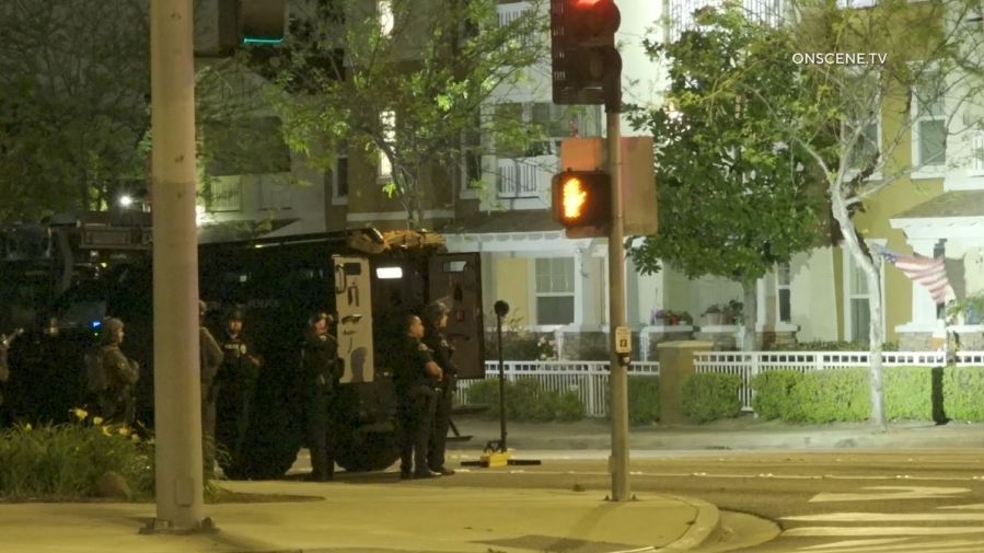 SWAT Team members surrounded an Anaheim senior apartment complex after a woman was shot to death on April 25, 2024. (OnScene.TV)