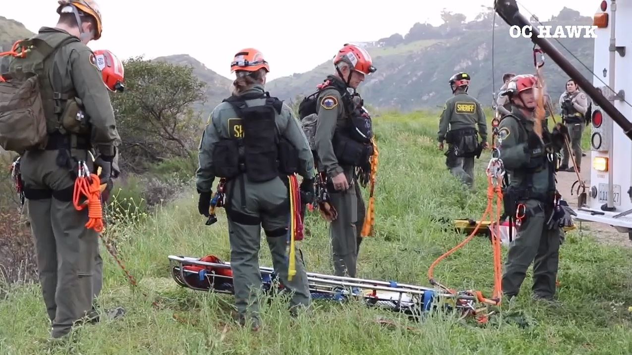 Crews descended down a Malibu cliffside after a driver was killed in a crash on April 3, 2024. (OC Hawk)