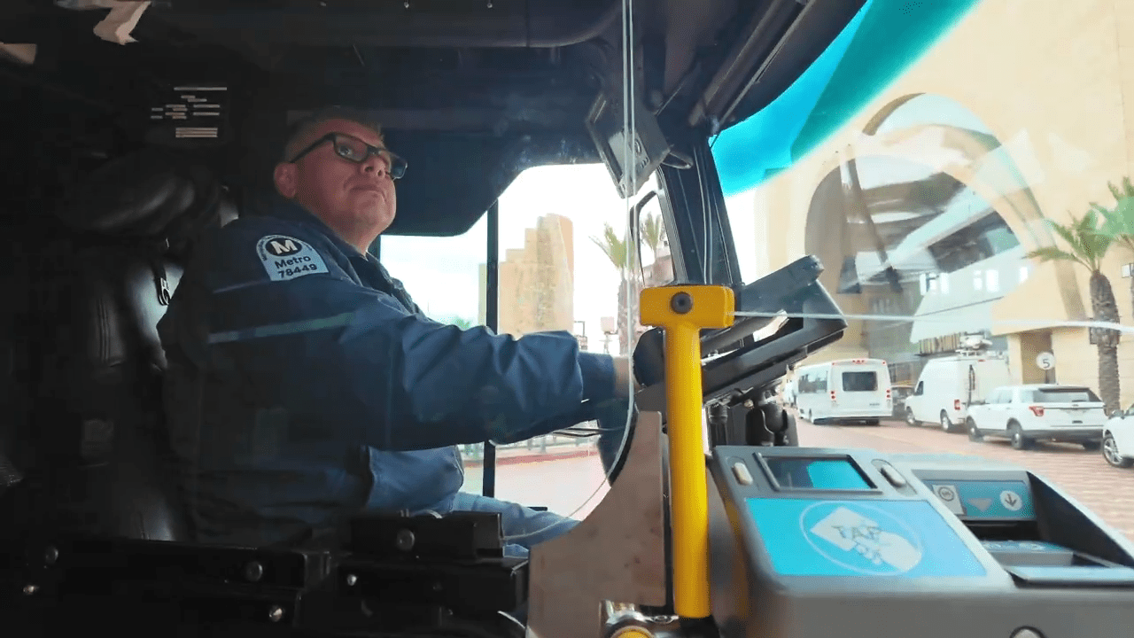 Video from LA Metro shows a bus driver behind a full plexiglass barrier that is larger and offers more cover than current barriers installed in 2020. (LA Metro)