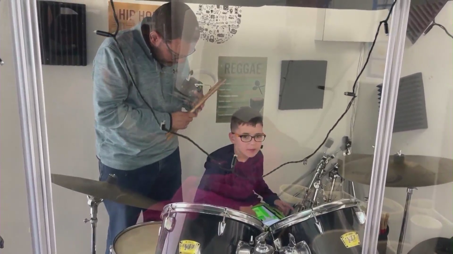 Students making music at a practice session with Jazz Hands for Autism. (KTLA)