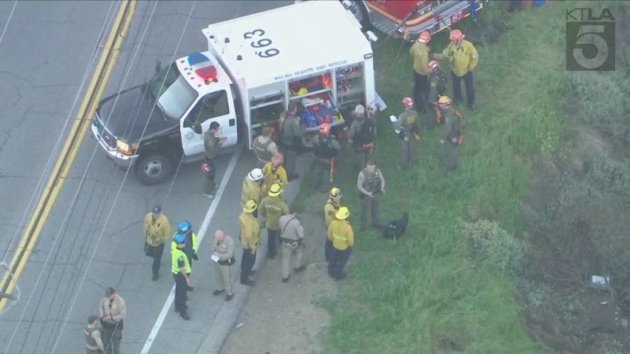 Crews descended down a Malibu cliffside after a driver was killed in a crash on April 3, 2024. (KTLA)