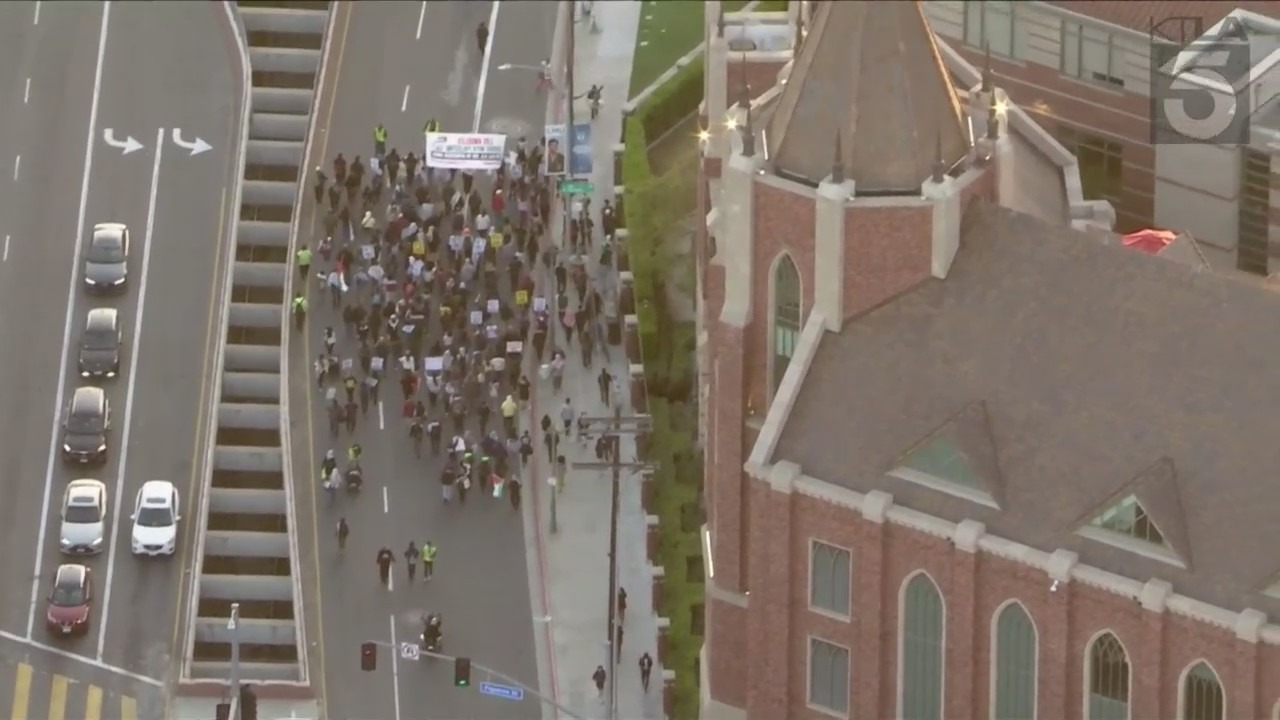 Group of protestors leaving USC's campus and continuing to march down surrounding streets on April 24, 2024. (KTLA)