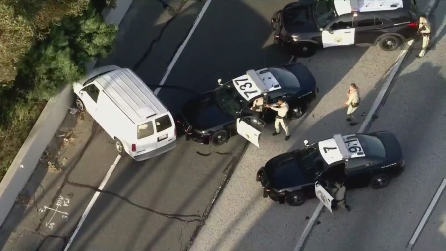 Seveal non-lethal rounds were fired into the van's passenger side window on the 91 Freeway. (KTLA)