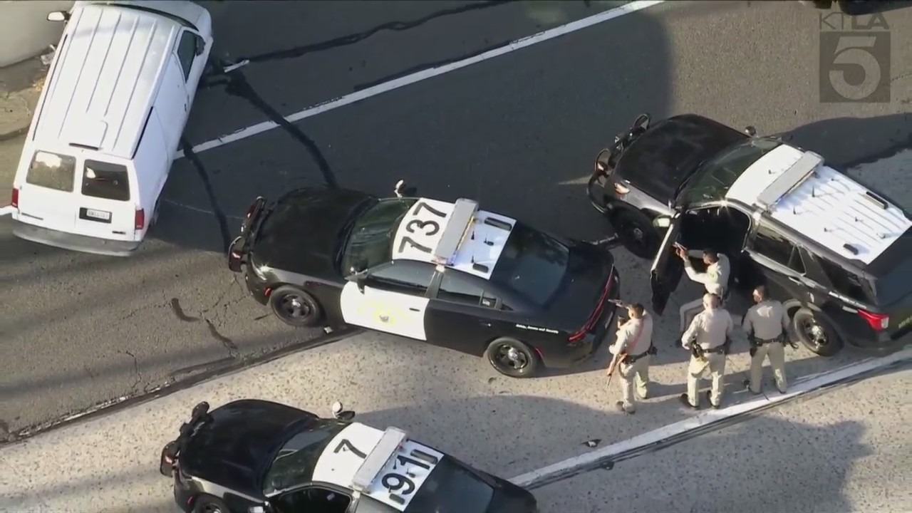 Seveal non-lethal rounds were fired into the van's passenger side window on the 91 Freeway. (KTLA)