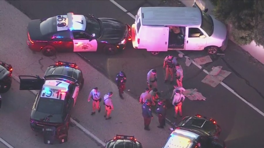 Officers investigated the suspect's van after an hours-long standoff ended on the 91 Freeway on April 26, 2024. (KTLA)