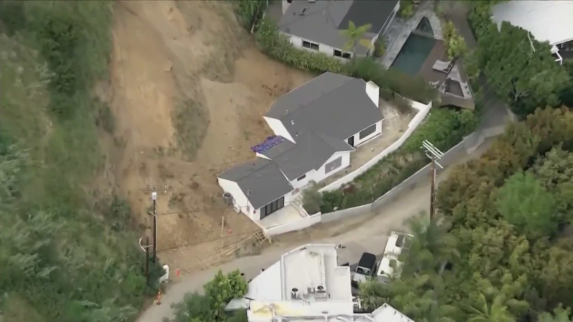 A Hollywood Hills home was partially buried by a large landslide on April 4, 2024. (KTLA)