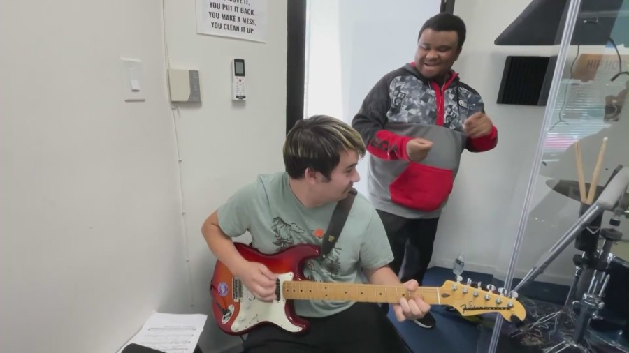 Students making music at a practice session with Jazz Hands for Autism. (KTLA)