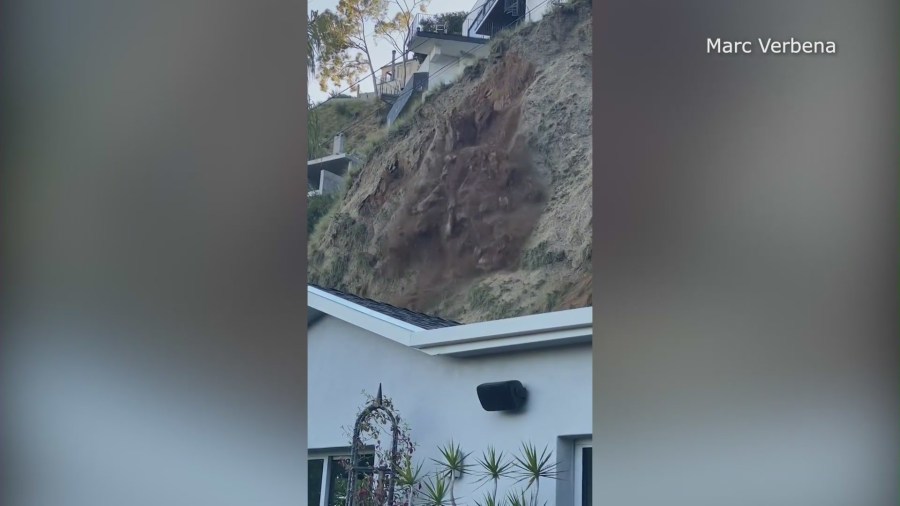 The moment a hillside began to crumble before partially burying a Hollywood Hills home on April 4, 2024. (Marc Verbena)